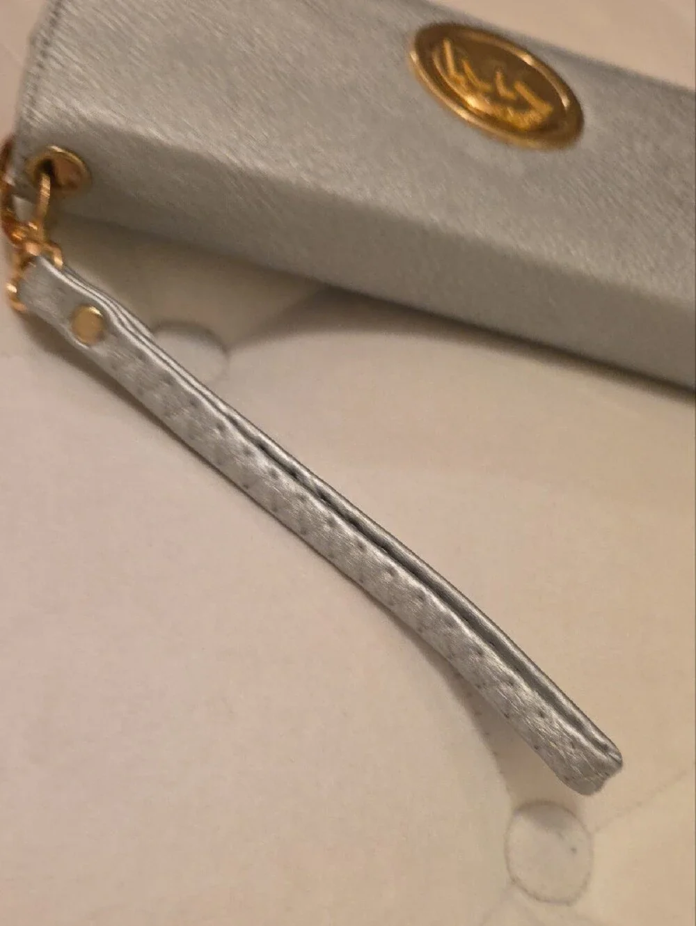 Michael Kors Silver-Gray Zip Around Wristlet Wallet with Gold MK Emblem
